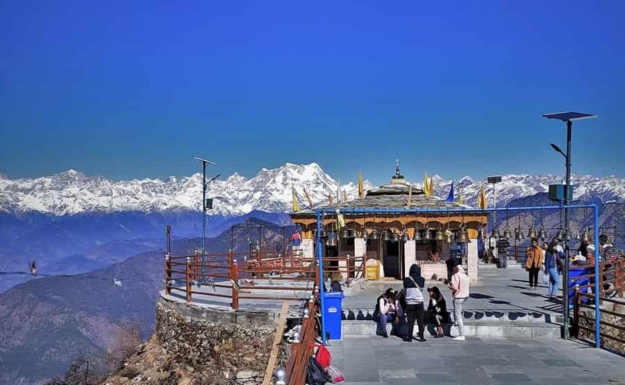 Tungnath Temples, a Famous Temples of Uttarakhand, located in the Himalayas with stunning snow-covered peaks and devotees visiting the sacred site.